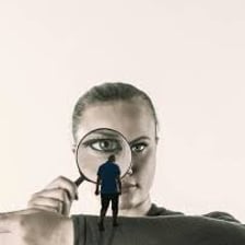 A person examining an object with an intent gaze