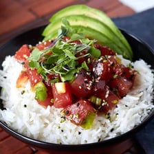 A bowl of Hawaiian poke containing diced raw fish and rice
