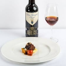 A glass of dark oloroso sherry.