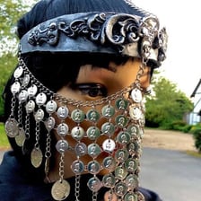 A traditional yashmak-style face veil covering the lower face
