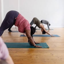 A person practicing yoga on a mat