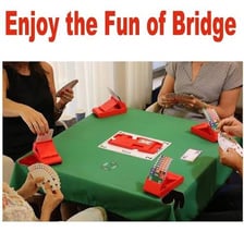 Players at a bridge table during a bidding round