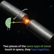 Metal pieces being joined together by welding.