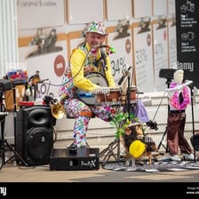 A solo musician performing onstage.