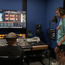 A music producer working in a recording studio