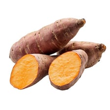 An orange-fleshed yam shown whole and cut open