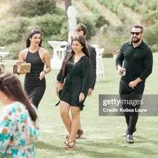 A person arriving at a gathering.