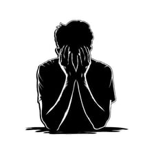 A person showing visible sadness and distress