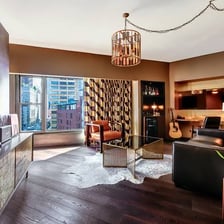The living area and bedroom of a hotel suite