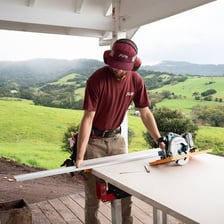A person putting a tool to practical use.
