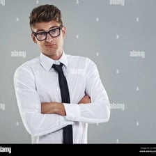 A person standing in a defiant posture with arms crossed.