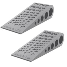 A wedge-shaped doorstop holding a door open