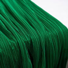 A close-up view of a neatly folded fabric pleat