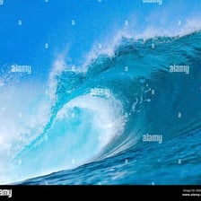 An ocean wave forming a curved, curling shape