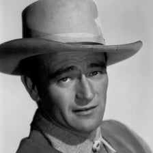 A portrait of actor John Wayne in Western-film attire.