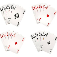 Playing cards spread out from a standard deck