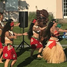 A Hawaiian luau with food and traditional dancers