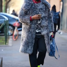 A person dressed in a coat and other clothing