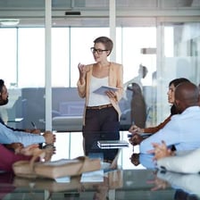 Business executives seated at a corporate meeting