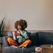 A person seated on a sofa
