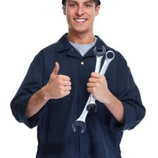 A person employing a hand tool to complete a task