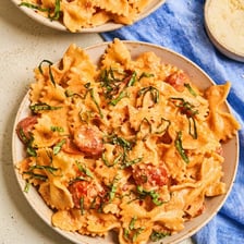 Farfalle pasta pieces with pinched centers and bow-tie shapes