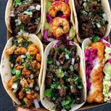 A folded taco filled with food