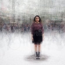 A person surrounded by a dense crowd.