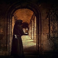 Monks in robes at a historic abbey