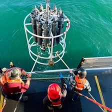 A crew working aboard a ship