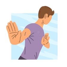 A person signaling refusal with an outstretched hand