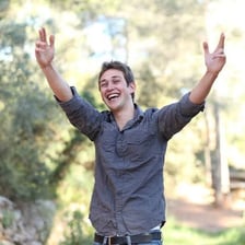 A smiling person showing evident happiness