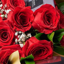 A bouquet of red roses presented as a Valentine’s gift