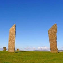 A large upright standing stone in a landscape