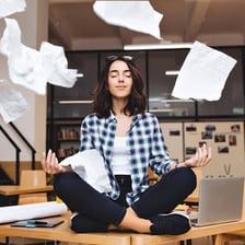 An office worker pausing during a work break