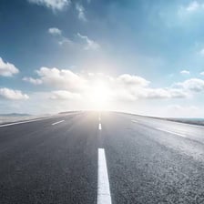 A road extending toward a seemingly endless horizon