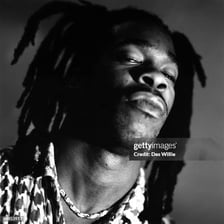 Portrait of rapper Busta Rhymes performing or posing.
