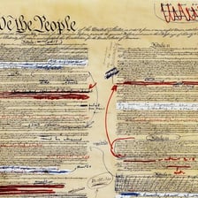 A document marked with revisions and amendments