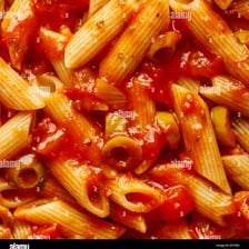 A bowl of tube-shaped penne pasta