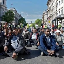 Protesters seated together during a peaceful demonstration