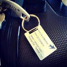 An identification tag attached to a suitcase