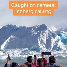 A large chunk of ice breaking away from a glacier.