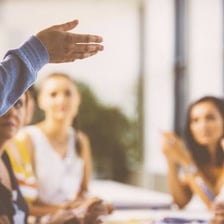 People discussing an issue while one person offers advice