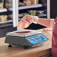 A digital scale on a deli counter.