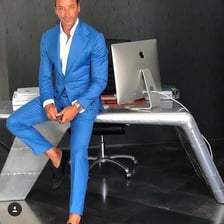 A stylishly dressed person wearing a polished outfit