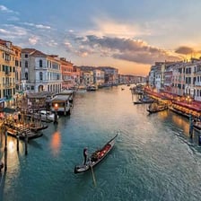 Gondolas moving along Venice’s Grand Canal