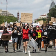 People participating in an anti-racism demonstration