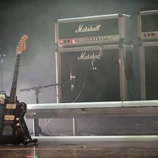 Several musical amplifiers positioned on a concert stage