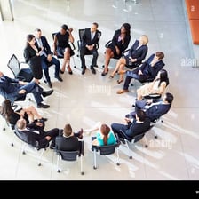 A group of coworkers meeting together.