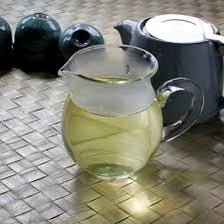 A ceramic teapot containing tea